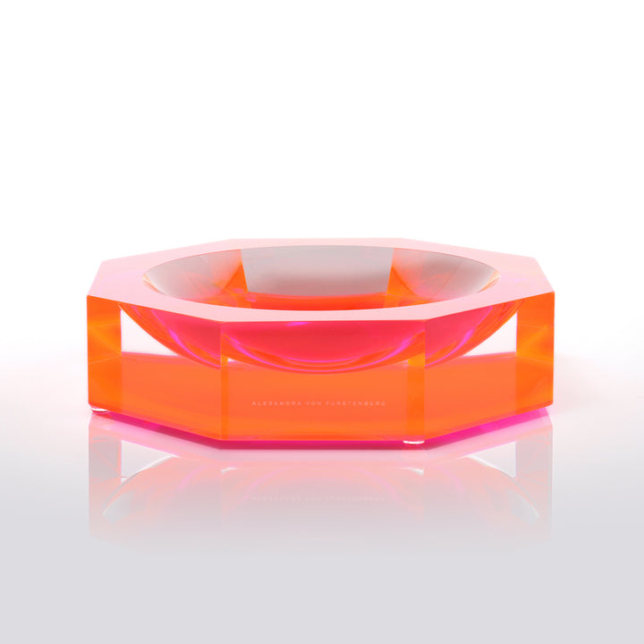 Vibrantly orange hexagonal acrylic bowl by Alexandra Von Furstenberg.