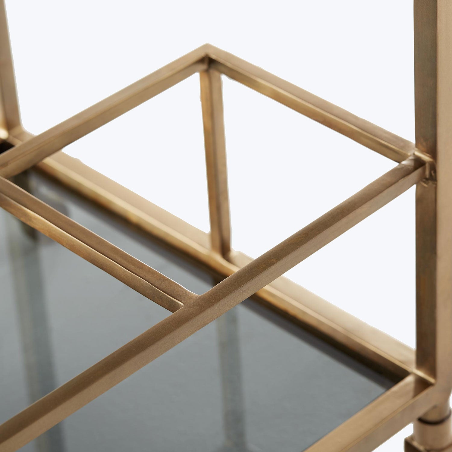 Close-up of a gold metallic frame in angular design.