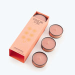 Set of three peach-colored scented candles by Ginori 1735.