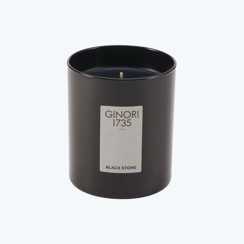 Black Stone candle by GINORI 1735, featuring a cylindrical design.