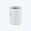 Sleek white ceramic candle holder with artistic relief of face.