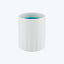 Smooth white candle with teal wax partially visible at top.