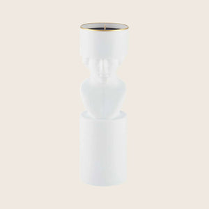 Sleek and modern white candle with classical bust design.