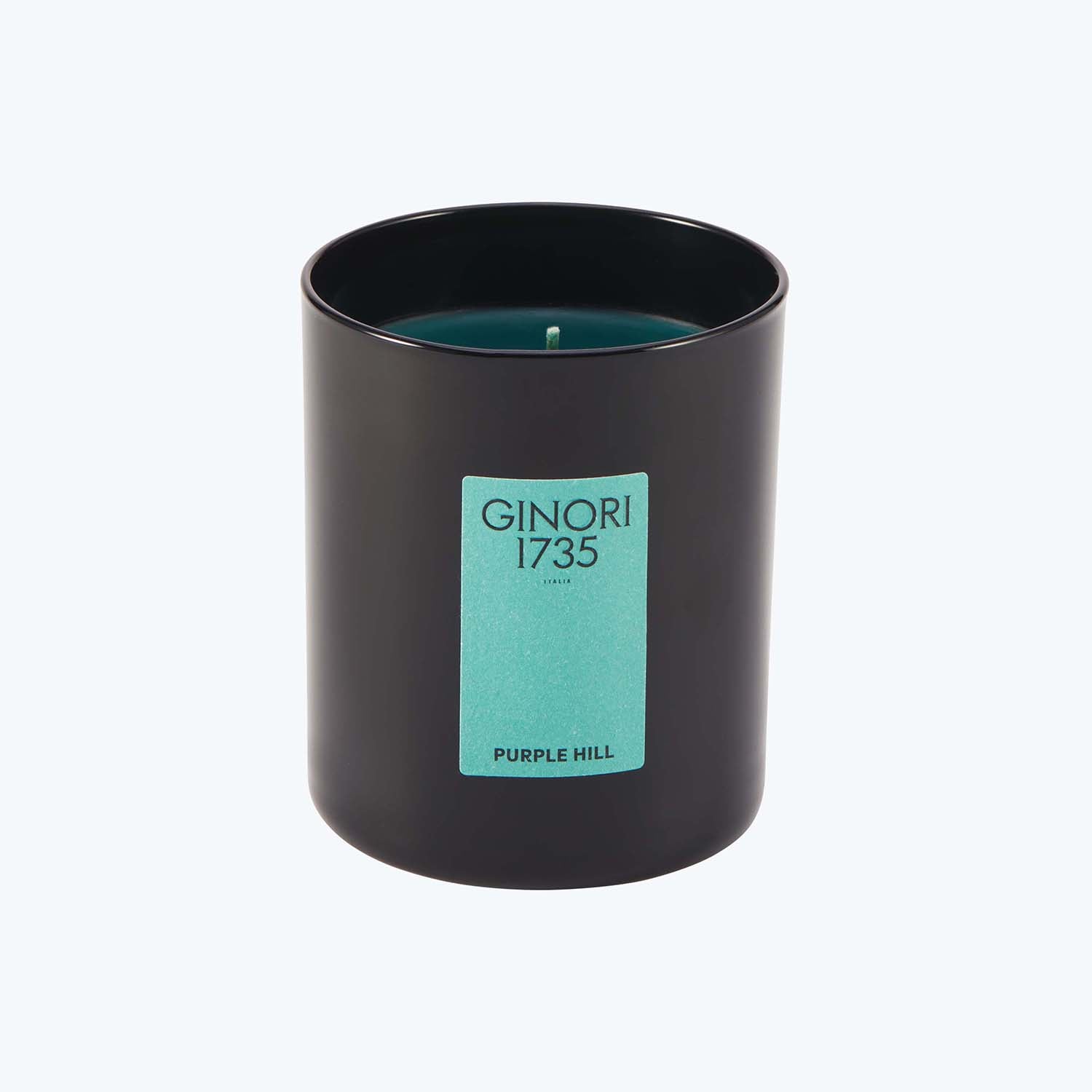 Luxurious scented candle in dark container, labeled 'GINORI 1735 - PURPLE HILL'.