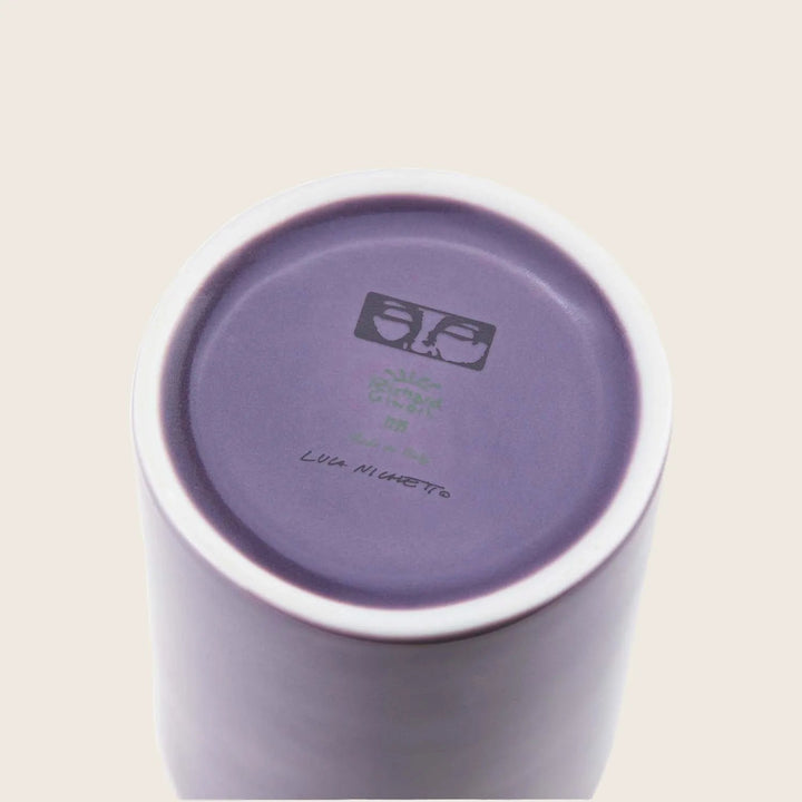 Bottom of lilac mug with maker's mark and handwritten signature.