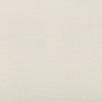 Close-up of textured surface with fabric-like pattern and speckles.