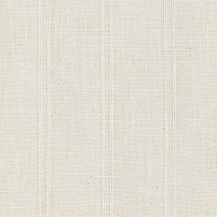 Close-up of light beige fabric with fine weave and speckles.