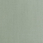 Close-up of muted green fabric with raised diamond-shaped pattern.