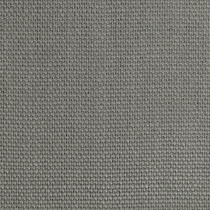 Close-up of gray fabric with tight weave and repetitive pattern.