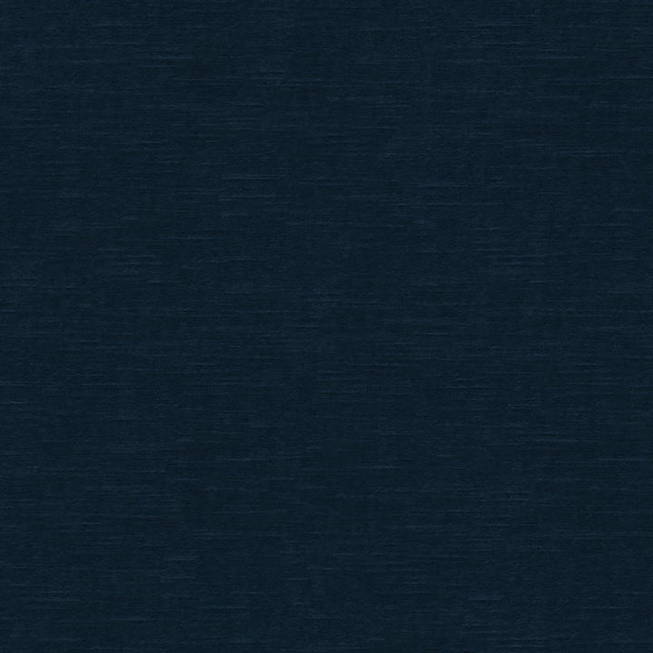 Close-up shot of a deep navy blue textured fabric background.