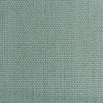 Close-up of green fabric with tight, consistent weave and squares.