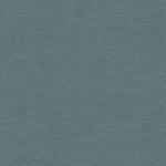 Blue textured surface resembling denim fabric with visible thread patterns.