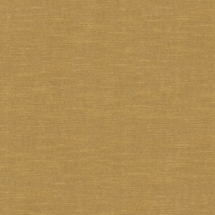 Close-up of a uniform mustard fabric with a fine texture.
