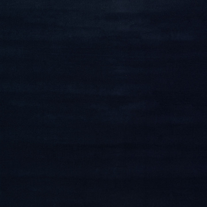 Abstract, dark composition with textured black strokes in low-light environment.