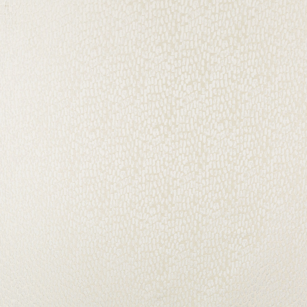 Close-up of a cream-colored textured surface resembling bumpy leather.