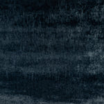 Abstract textured surface with a gradient of dark tones and uneven texture.