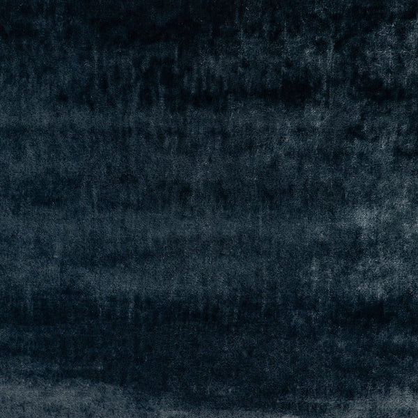 Abstract textured surface with a gradient of dark tones and uneven texture.