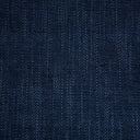 Close-up of a textured denim fabric with diagonal weave pattern.