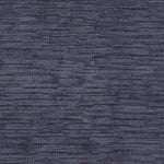 Close-up of a textured blue fabric, evoking depth and texture.