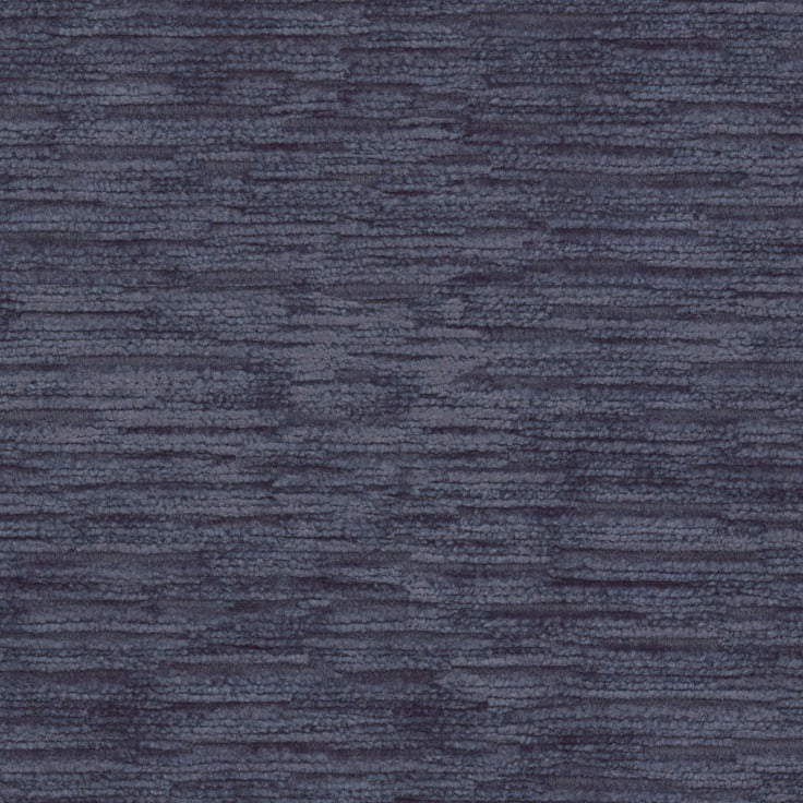 Close-up of a textured blue fabric, evoking depth and texture.