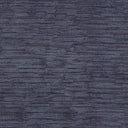 Close-up of a textured blue fabric, evoking depth and texture.