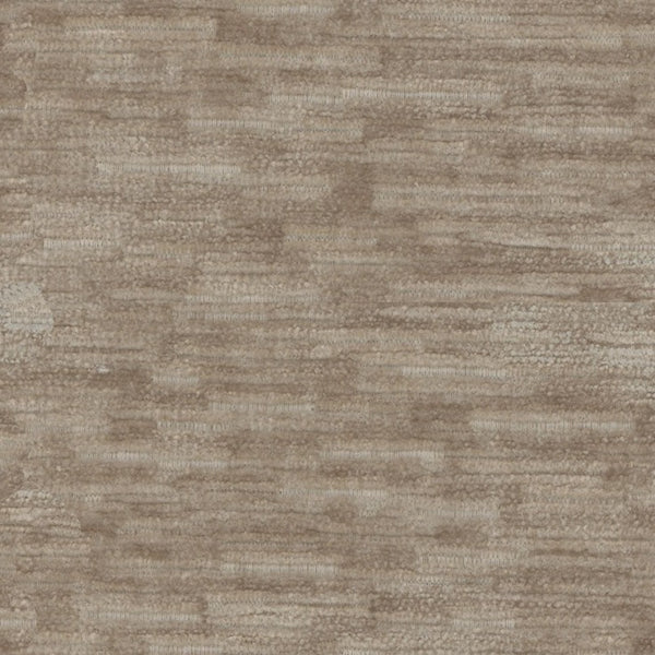 Close-up of earth-toned, textured material resembling coarse woven fabric.