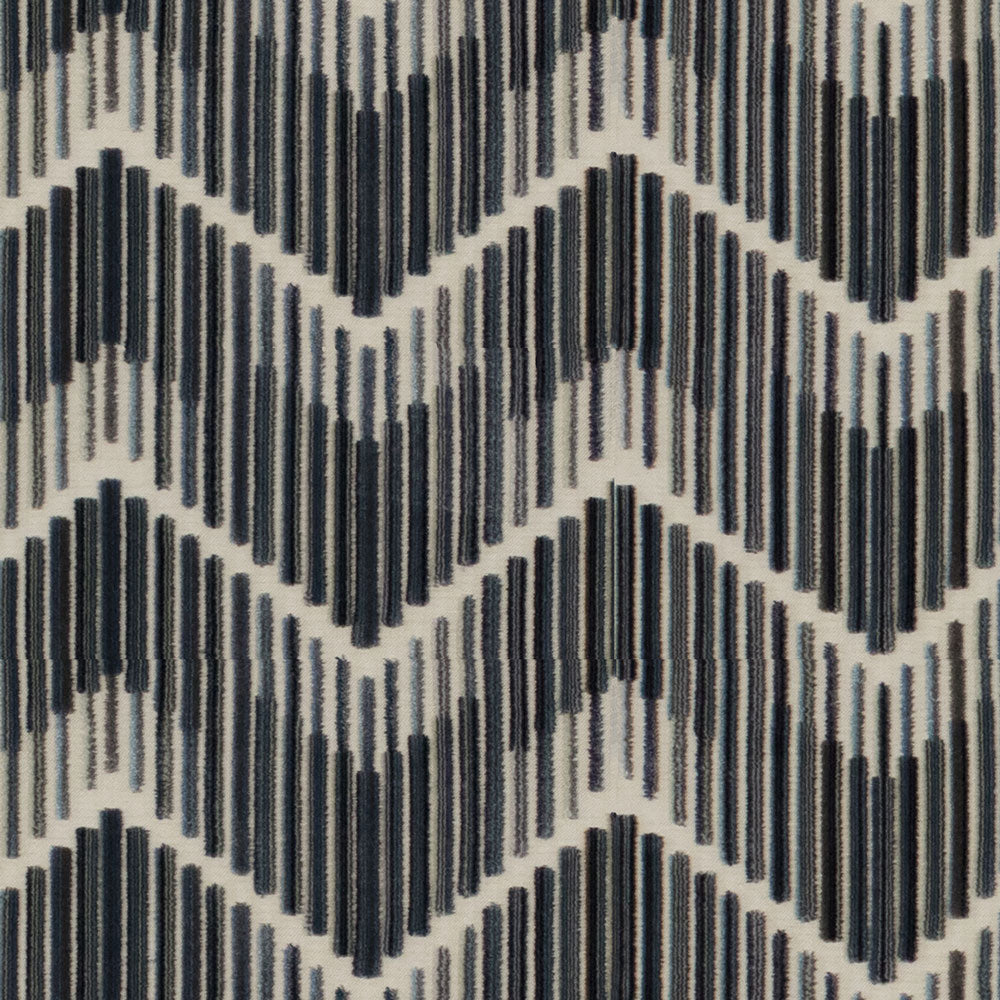 Textile with a geometric zigzag pattern in shades of blue.