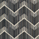 Textile with a geometric zigzag pattern in shades of blue.