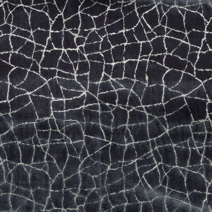 Close-up of a dark blue fabric with cracked mosaic pattern