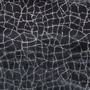 Close-up of a dark blue fabric with cracked mosaic pattern