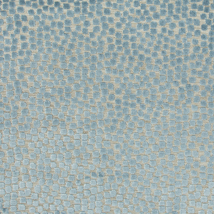 Textured fabric with interconnected dark blue geometric shapes on light blue background.