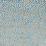 Textured fabric with interconnected dark blue geometric shapes on light blue background.