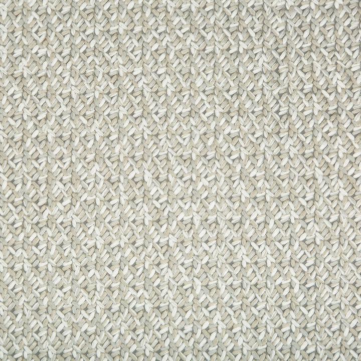 Close-up of a basketweave pattern on a natural-colored woven material.