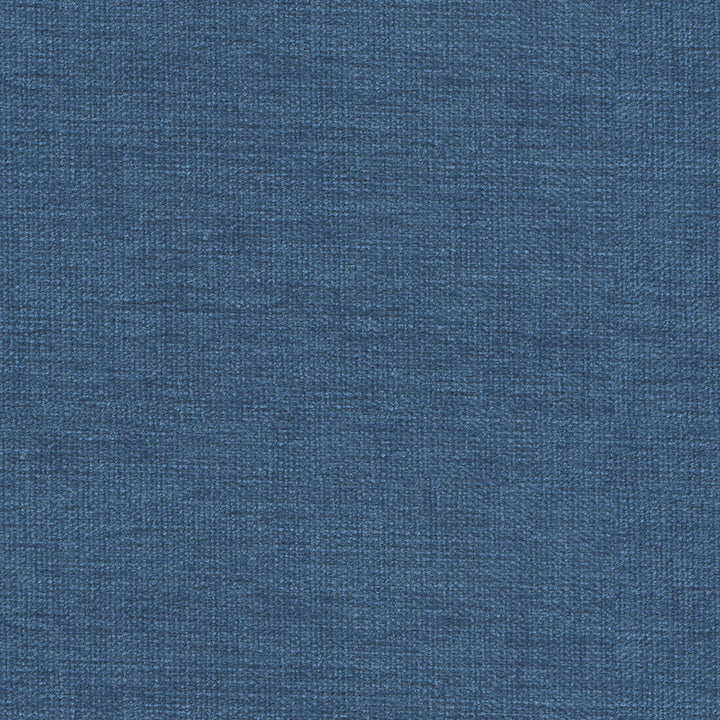 Close-up of blue denim fabric showcasing its characteristic diagonal ribbing