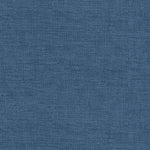 Close-up of blue denim fabric showcasing its characteristic diagonal ribbing