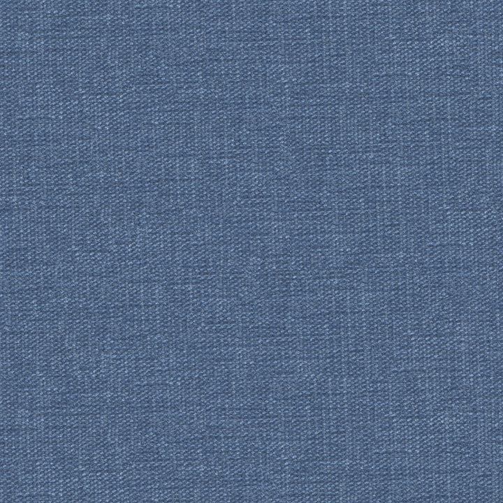Close-up of blue denim fabric showcasing iconic diagonal ribbing.