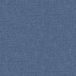 Close-up of blue denim fabric showcasing iconic diagonal ribbing.