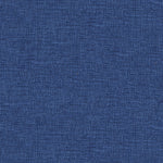 Close-up of textured denim fabric showcasing its iconic blue hue