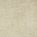 Close-up view of textured fabric with geometric pattern and neutral colors.