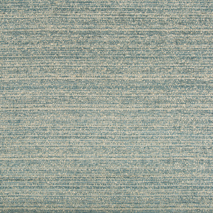 Textured fabric with intricate weave pattern in shades of blue.