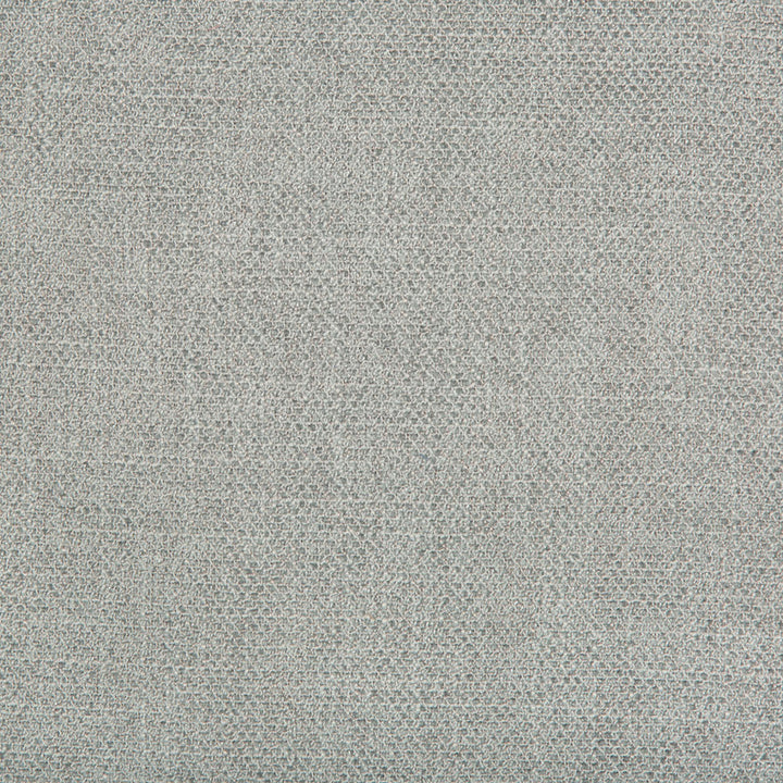 Close-up of a fine, grainy textured surface in neutral grey.