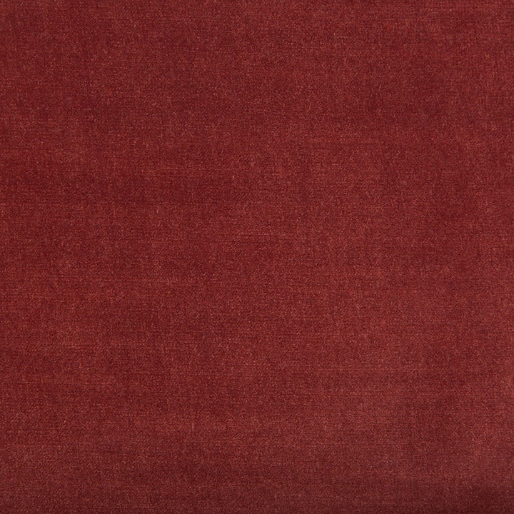 Close-up of a luxurious maroon fabric with woven texture.