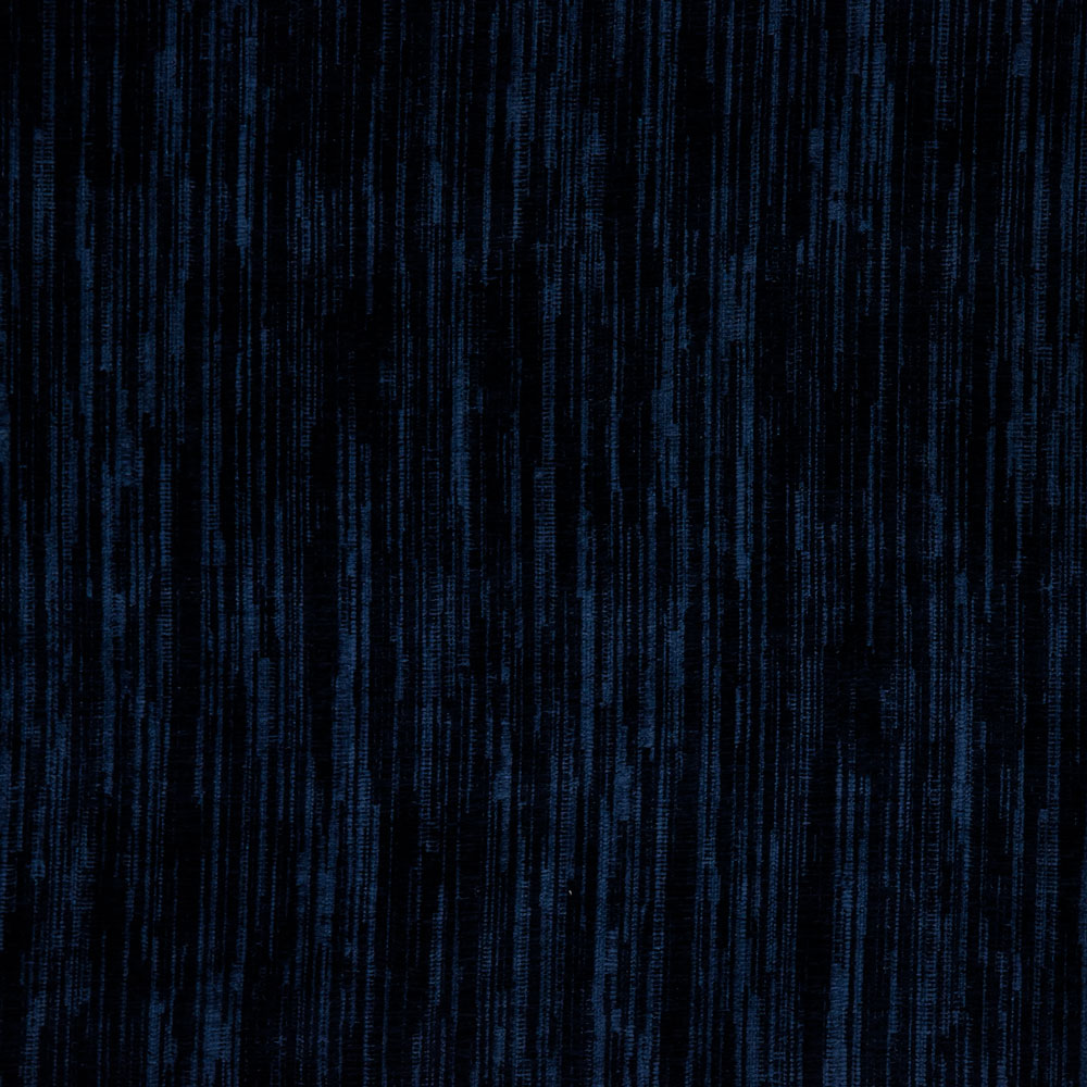 Monochromatic blue texture with irregular vertical streaks resembling distressed fabric.
