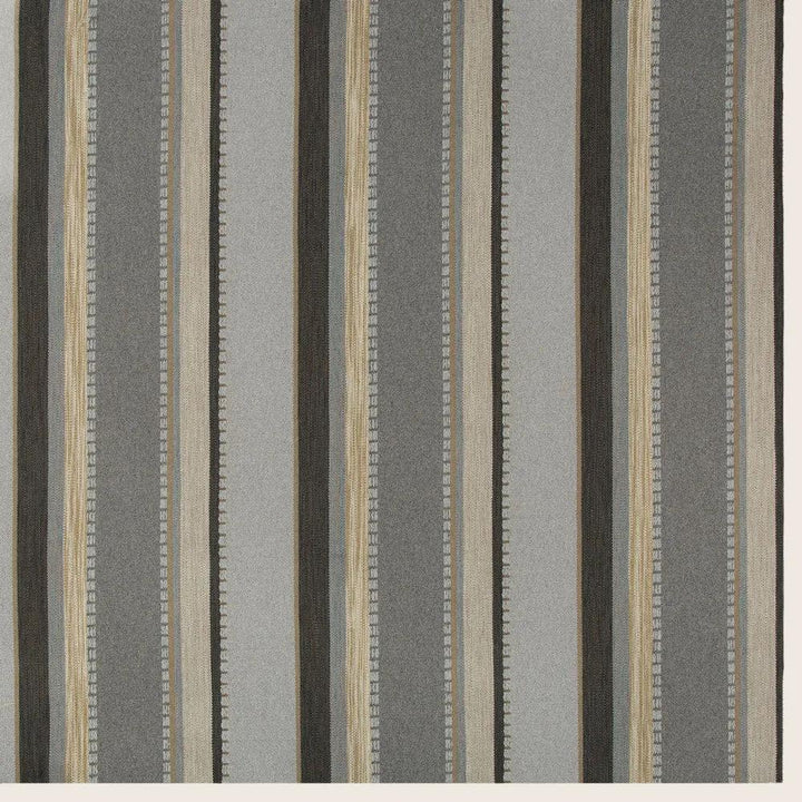 Close-up of striped fabric with vertical variation in width, color, and texture.