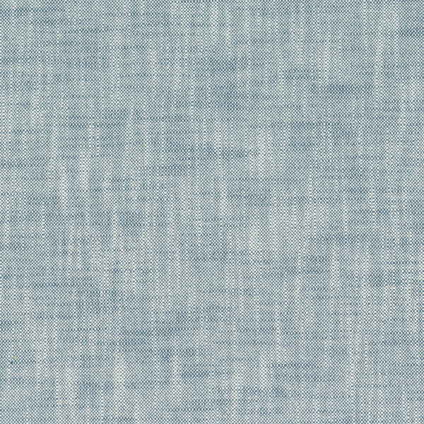 Close-up view of light blue denim fabric showcasing textured, interlaced weave.