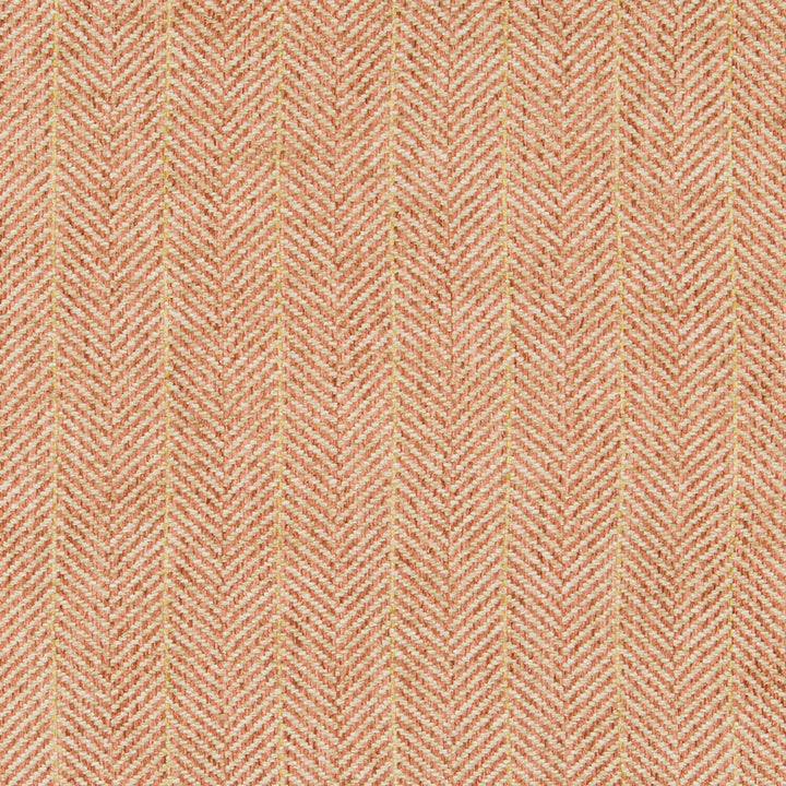 Close-up of a herringbone fabric with orange threads, textured appearance.