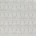 Textured fabric with tribal-inspired geometric pattern in contrasting stitches.