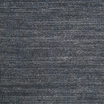 Close-up image of indigo denim fabric with intricate woven texture.