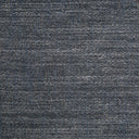 Close-up image of indigo denim fabric with intricate woven texture.