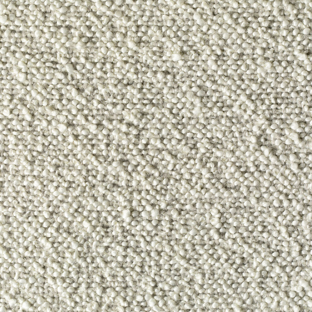 Close-up of off-white fabric with looped pile texture.